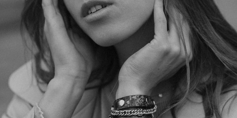 Detail of hands in a meditative pose.